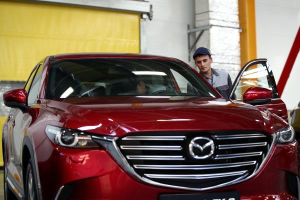 Employees work on the production line of the CX-5 model car at the Mazda Sollers Manufacturing Rus joint venture plant of Sollers and Japanese Mazda in Vladivostok