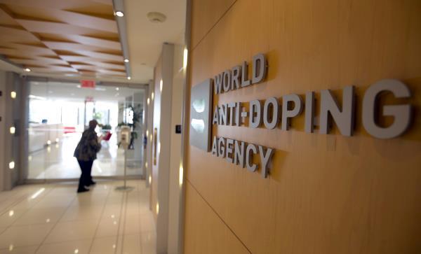 A woman walks into the head offices of WADA in Montreal