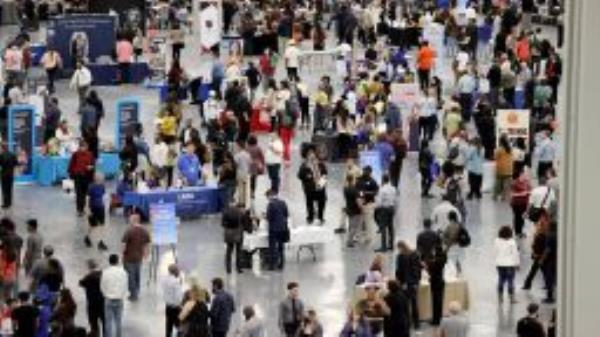 Job seekers visit booths during the Spring Job Fair at the Las Vegas Convention Center Friday, April 15, 2022.