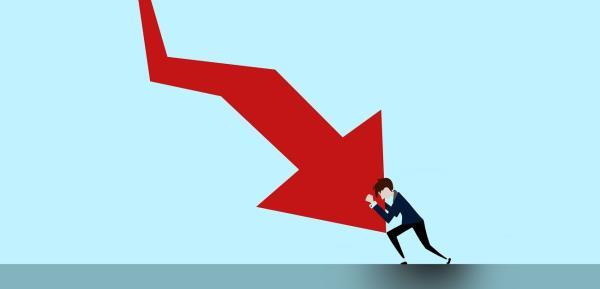 Man stopping arrow going down