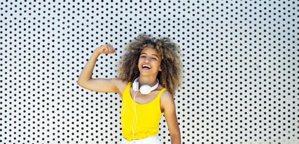 Young woman flexing muscles