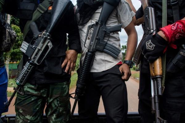 Members of the Karenni Nationalities Defence Force and Karenni Army at a checkpoint in Myanmar's eastern Kayah state in 2021 