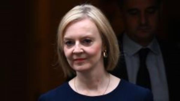 Britain's Prime Minister Liz Truss walks out of Number 10 Downing Street on her way to the House of Commons for the government's anti-inflation budget plan in London on September 23, 2022. 