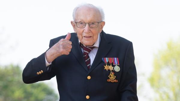 File photo dated 16/04/2020 of the then 99-year-old war veteran Captain Tom Moore at his home in Marston Moretaine, Bedfordshire, after he achieved his goal of 100 laps of his garden. Captain Sir Tom Moore has died at the age of 100 after testing positive for Covid-19, his daughters Hannah and Lucy said in a statement. Issue date: Tuesday February 2, 2021.