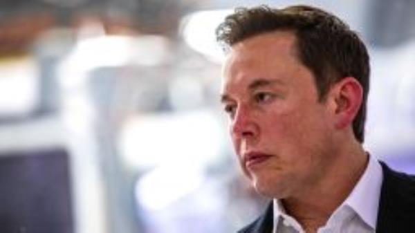 SpaceX founder Elon Musk addresses the media during a press conference announcing new developments of the Crew Dragon reusable spacecraft, at SpaceX headquarters in Hawthorne, California on October 10, 2019. 