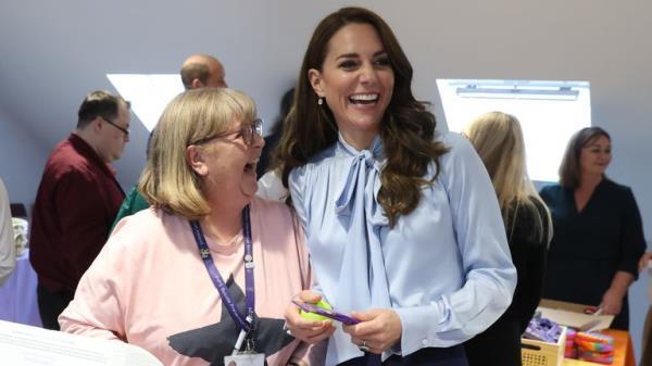 The Princess of Wales speaks to a volunteer during a visit to PIPS Suicide Prevention (PIPS Charity) in Belfast which works across communities in the city and throughout Northern Ireland to provide crisis support for those at risk of suicide and self-harm, as part of the royal visit to Northern Ireland. Picture date: Thursday October 6, 2022.
