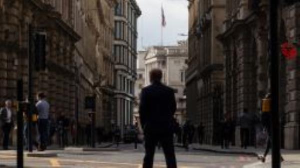 City workers walk near the Bank of England (BOE) in the City of London, UK, on Monday, Oct. 3, 2022. 
