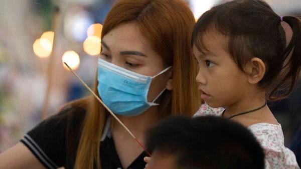 Paweenuch Supolwong and her mother pictured at a Buddhist ceremony at a temple in north-eastern Thailand Pic: AP 