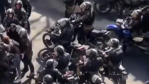 Video shared online showed a police officer sexually assaulting a female protester while trying to arrest her in Tehran's Argentina Square 