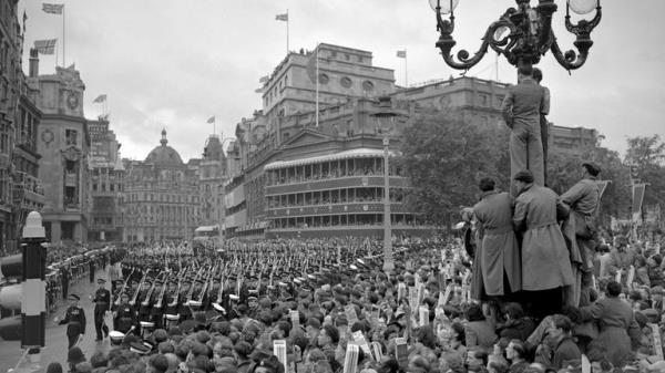 File photo dated 2/6/1953 of crowds in Trafalgar Square in the rain watch as troops march past on the return from Westminster Abbey after the Queen's coronation. The Queen's coronation, rich in religious significance, was a morale boost for a nation starved of pageantry by the war, and for a day street parties banished the hardship of rationing and shortages and even atrocious, unseasonal weather did not dampen the enthusiasm. Issue date: Thursday September 8, 2022.