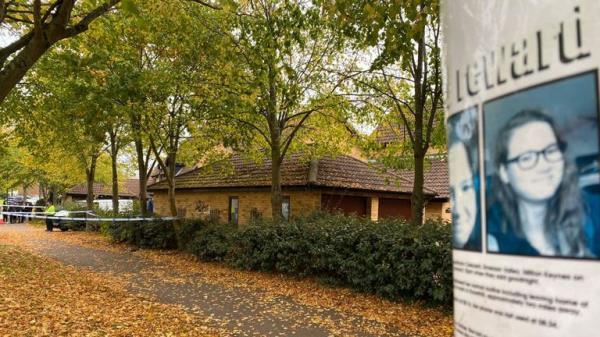 A poster offering a ��5,000 reward is close to the house being searched