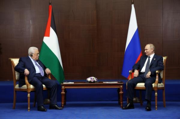 Russian President Vladimir Putin meets with Palestinian president Mahmud Abbas on the sidelines of the Sixth Summit of the Conference on Interaction and Confidence Building Measures in Asia (CICA) in Astana on October 13, 2022.