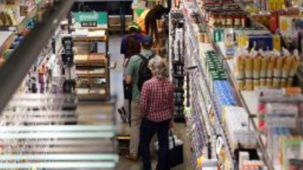 People shop at a local supermarket in Washington, D.C., the United States, Sept. 13, 2022. (Photo by Ting Shen/Xinhua via Getty Images)