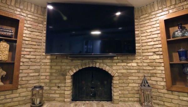 Massive TV on fireplace