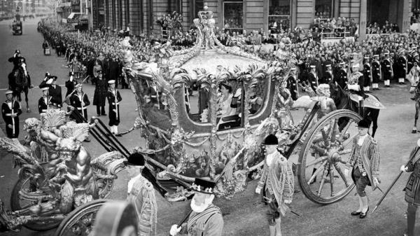 File photo dated 2/6/1953 of Queen Elizabeth II riding with the Duke of Edinburgh in the State Coach through Trafalgar Square on the way from Buckingham Palace to Westminster Abbey for her coronation. The Queen's coronation, rich in religious significance, was a morale boost for a nation starved of pageantry by the war, and for a day street parties banished the hardship of rationing and shortages and even atrocious, unseasonal weather did not dampen the enthusiasm. Issue date: Thursday September