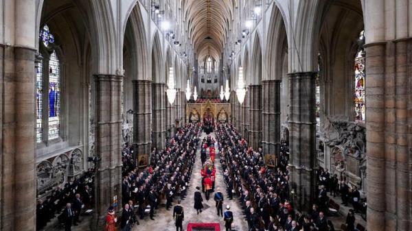King Charles III and members of the royal family follow behind the coffin of Queen Elizabeth II, draped in the Royal Standard with the Imperial State Crown and the Sovereign's orb and sceptre, as it is carried into Westminster Abbey during State Funeral. Picture date: Monday September 19, 2022. Danny Lawson/Pool via REUTERS