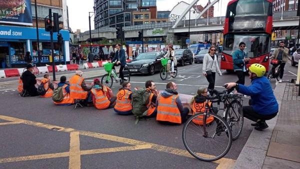 Handout photo issued by Just Stop Oil of protesters blocking Shoreditch High Street in London. Picture date: Saturday October 15, 2022.


