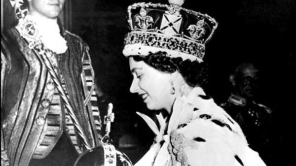 FILE - In this June 2, 1953 file photo, Britain's Queen Elizabeth II wearing the bejeweled Imperial Crown and carrying the Orb and Scepter with Cross, leaves Westminster Abbey, London, at the end of her coronation ceremony. On Monday Feb. 6, 2017, Queen Elizabeth II marks her Sapphire Jubilee, becoming the first British monarch to reign for 65 years. (AP Photo/File)