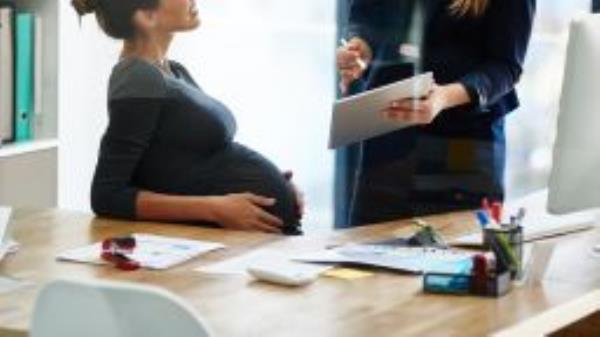 Pregnant woman office STOCK