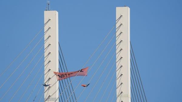 Just Stop Oil protesters continue their protest for a second day on the Queen Elizabeth II Bridge, which links Kent and Essex and which remains closed for traffic, after it was scaled by two climbers from the group. Picture date: Tuesday October 18, 2022.
