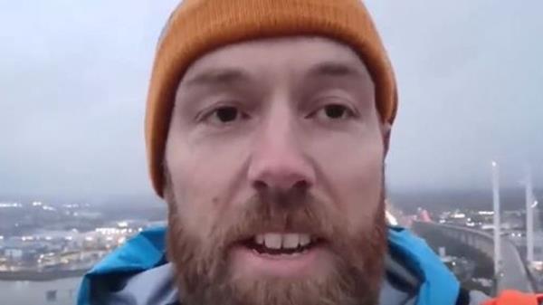 Morgan Trowland is one of the protesters at the top of the bridge