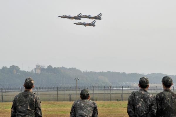 Three South Korean fighter jets take off during an air show at a military air base in Cheongju, South Korea.