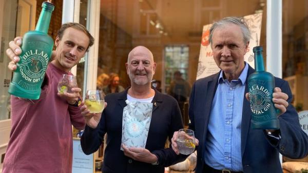 Undated handout photo issued by Bullards of George and John Bullard with Russell Evans. Artisanal gin maker Bullards has won a legal battle against Red Bull, after the energy drinks manufacturer claimed that the word 'bull' within Bullards could case confusion. Norwich-based spirits firm Bullards, which has around 10 staff, had received a letter from lawyers acting for Red Bull opposing its application to register Bullards as a trademark. Issue date: Friday October 28, 2022.
