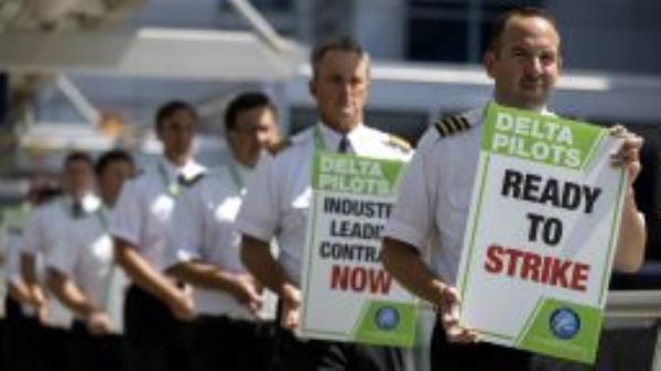 Delta Air Lines pilots picketed Thursday, June 30, 2022, at Minneapolis-Saint Paul International Airport in Minneapolis, Minn. The picketing involved hundreds of off-duty Delta pilots at the airline's major hubs. The Air Line Pilots Association at Delta said it was picketing to protest "protracted contract negotiations," while working under a labor contract that dates back to 2016, adding that they haven't had a pay raise in three-and-a-half years. The union, which represents Delta's 13,900 pilots, said it is seeking improvements in pay, retirement benefits and job protections, as well as changes to schedules.