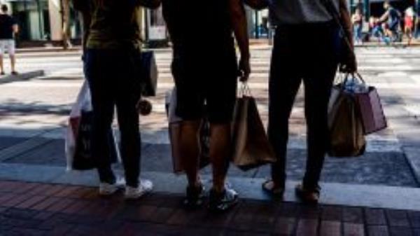 Shoppers carry bags in San Francisco, California, US, on Thursday, Sept. 29, 2022. 
