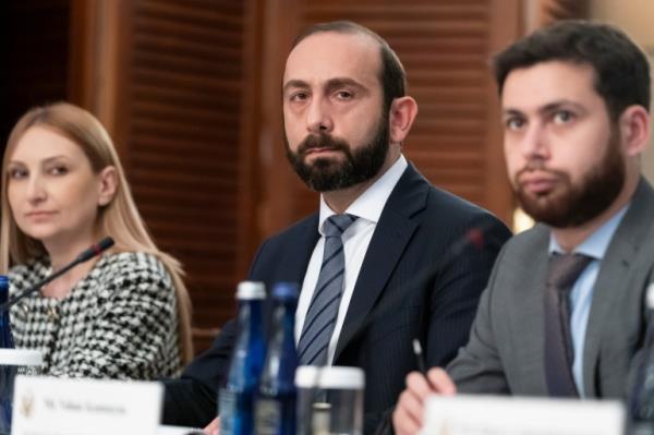Armenia's Foreign Minister Ararat Mirzoyan, center, listens during a meeting with Secretary of State Antony Blinken and Azerbaijan's Foreign Minister Jeyhun Aziz oglu Bayramov