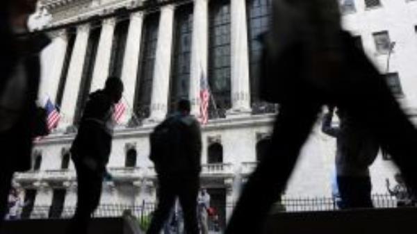 NEW YORK, NEW YORK - SEPTEMBER 23: People walk outside of the New York Stock Exchange (NYSE) on September 23, 2022 in New York City. (Photo by Spencer Platt/Getty Images)