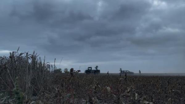 An open battlefield littered with shell casings