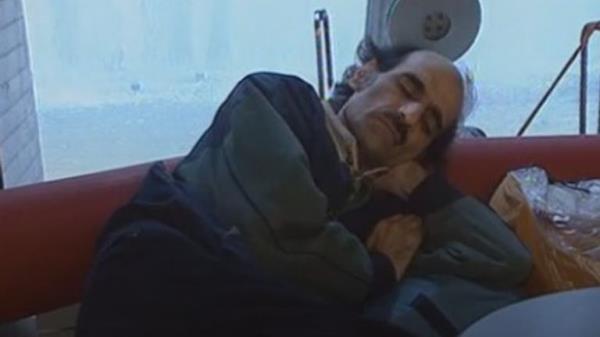 Mr Karimi Nasseri seen sleeping at the airport Pic: AP 