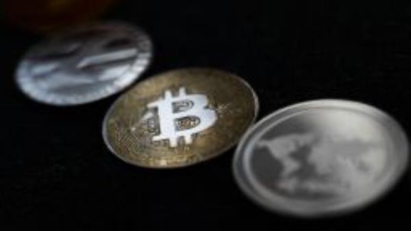 Representation of Bitcoin and other cryptocurrencies are seen in this illustration photo taken in Krakow, Poland on February 16, 2022. 