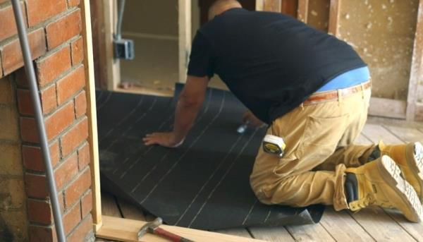 Covering the floorboards so they can acclimate 