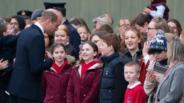 Prince William chatted with fellow Aston Villa fans,. twins Abi and Steph Boland