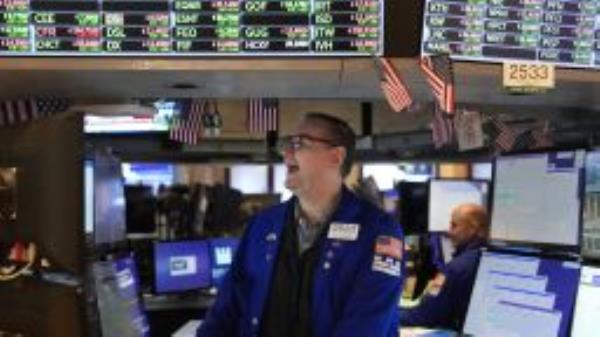 Traders work on the floor at the New York Stock Exchange in New York, Thursday, Nov. 10, 2022. 