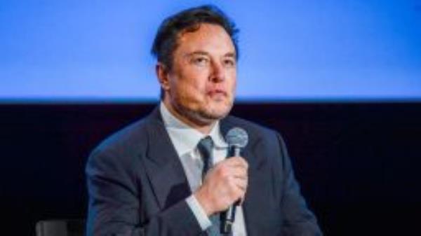 Tesla CEO Elon Musk looks up as he addresses guests at the Offshore Northern Seas 2022 (ONS) meeting in Stavanger, Norway on August 29, 2022. - The meeting, held in Stavanger from August 29 to September 1, 2022, presents the latest developments in Norway and internationally related to the energy, oil and gas sector. 
