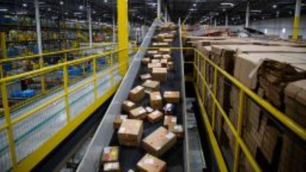 Packages move along a conveyor at an Amazon fulfillment center on Cyber Monday in Robbinsville, New Jersey, U.S., on Monday, Nov. 29, 2021. 