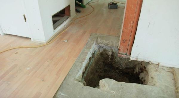 Hole in the floor to accommodate a support beam