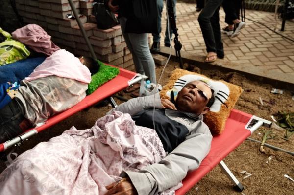 Survivors of West Java quake receive treatment at a hospital in Cianjur, Indonesia