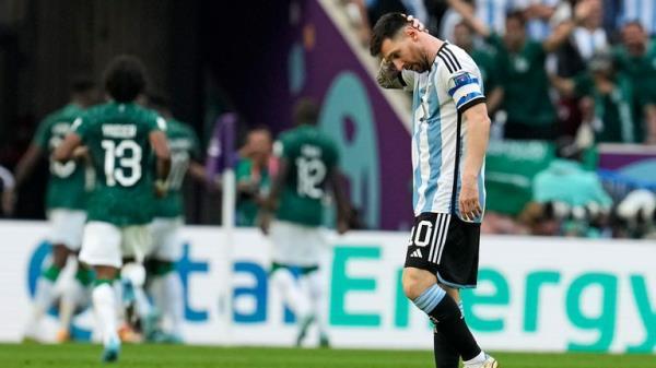 Argentina's Lionel Messi reacts as Saudi Arabia celebratie their first goal. Pic: AP