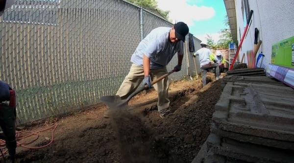 Digging a trench from the garage to the mainline 