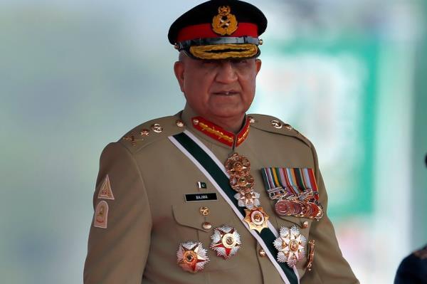 FILE - Pakistan's Army Chief General Qamar Javed Bajwa arrive to attend a military parade to mark Pakistan National Day in Islamabad, Pakistan, Wednesday, March 23, 2022. Officials say Pakistan��s powerful army chief in a rare move this week, Saturday, July 30, contacted Washington, urging U.S. authorities to use their influence to secure an early release of a key $1.7 billion installment from the International Monetary Fund. The latest development comes as Islamabad struggles to stave off a deepening economic crisis. (AP Photo/Anjum Naveed, File)