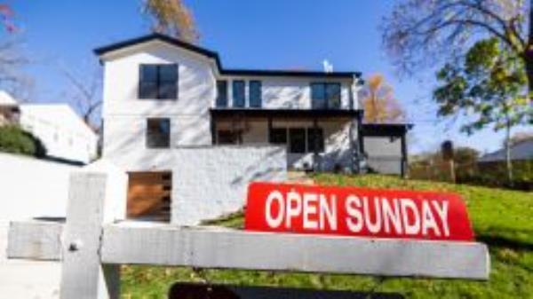 A 'For Sale' sign outside a single-family home in Bethesda, Maryland, USA, 27 October 2022. 