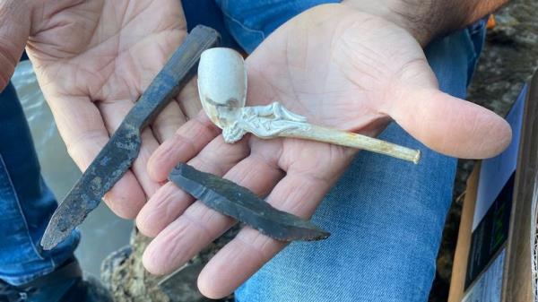 Mr Checconi's finds include an ornate ivory smoking pipe and a Tudor knife