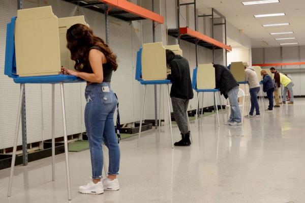 Residents cast their vote in the 2020 presidential election at a shuttered Sears store in the Janesville Mall on November 03, 2020 in Janesville, Wisconsin. 