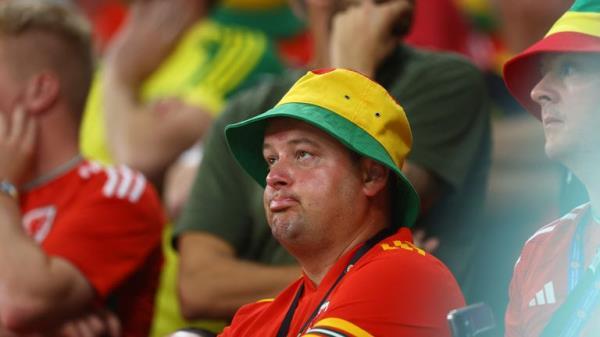 Soccer Football - FIFA World Cup Qatar 2022 - Group B - Wales v England - Ahmad Bin Ali Stadium, Al Rayyan, Qatar - November 29, 2022 Wales fan reacts after England's Marcus Rashford scored their third goal REUTERS/Lee Smith