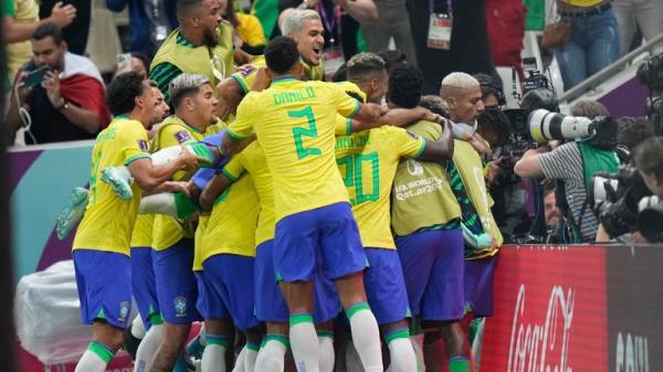 Brazil's Richarlison, right, is cheered by teamamtes after scoring during the World Cup group G soccer match between Brazil and Serbia, at the Lusail Stadium in Lusail, Qatar, Thursday, Nov. 24, 2022. (AP Photo/Aijaz Rahi)