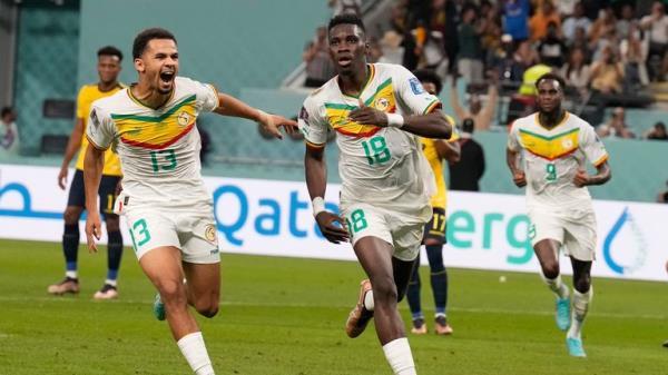Senegal's Ismaila Sarr, right, celebrates with teammates after scoring a penalty, the opening goal of his team, during the World Cup group A soccer match between Ecuador and Senegal, at the Khalifa International Stadium in Doha, Qatar, Tuesday, Nov. 29, 2022. (AP Photo/Natacha Pisarenko)